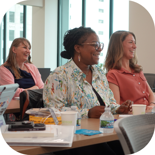 Members of the WEF cohort laugh at an event