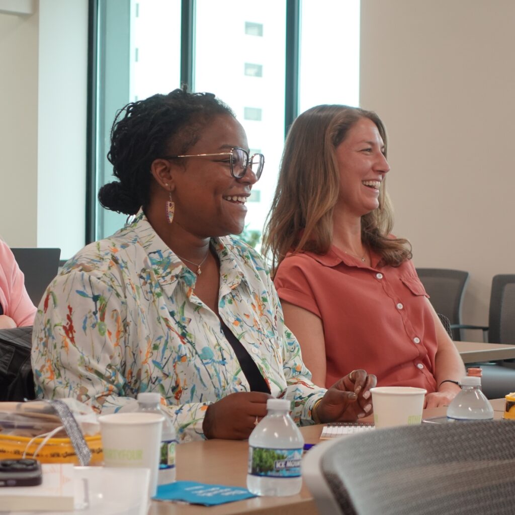 Members of the WEF cohort laugh at an event