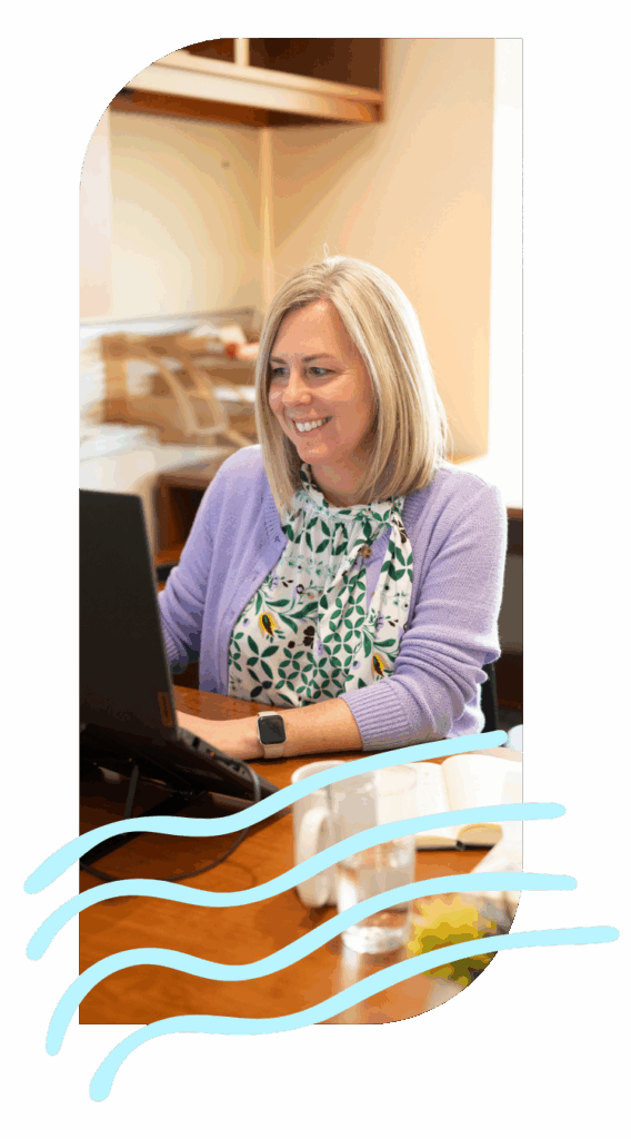 A member of the Women's Entrepreneurial Fellowship works on her computer.